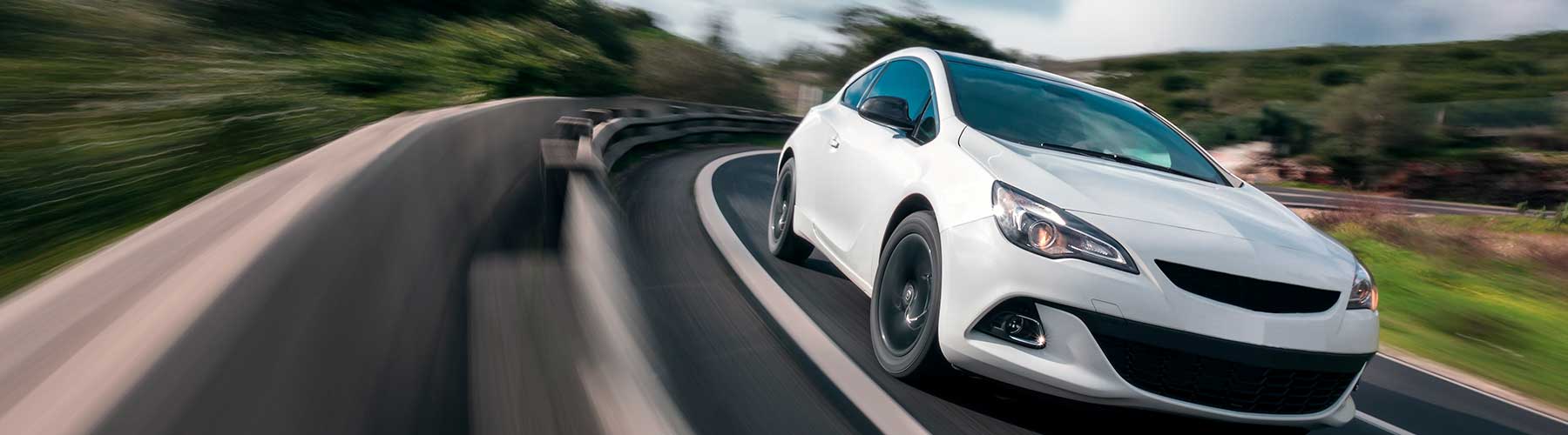 Auto insurance represented by a car driving on the highway